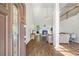 Bright living room featuring high ceilings, a fireplace, and hardwood floors at 115 Stonewall Dr, Covington, GA 30016