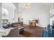 Bright, open living room with high ceilings, and hardwood floors at 115 Stonewall Dr, Covington, GA 30016
