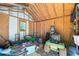 Bright storage shed interior with lots of room for tools and equipment with one small window at 115 Stonewall Dr, Covington, GA 30016