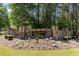 Stone-clad Livingston Willows community entrance, showcasing landscaped grounds, and inviting charm at 115 Stonewall Dr, Covington, GA 30016