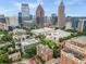 Stunning aerial view of Midtown Atlanta's skyline, lush trees, and historic buildings at 1325 Peachtree Ne St # 401, Atlanta, GA 30309