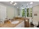 Bathroom with glass shower partition, marble countertop, and ample natural light at 1325 Peachtree Ne St # 401, Atlanta, GA 30309