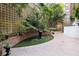 Exterior courtyard featuring lush landscaping, a decorative pond, and brickwork at 1325 Peachtree Ne St # 401, Atlanta, GA 30309