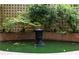 Charming courtyard featuring a water feature, brick accents, and lush greenery, creating a serene outdoor oasis at 1325 Peachtree Ne St # 401, Atlanta, GA 30309