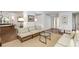 Cozy living room with comfortable seating, a patterned rug, and neutral color palette with access to the kitchenette at 1325 Peachtree Ne St # 401, Atlanta, GA 30309
