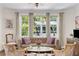Cozy living room showcasing large windows, decorative pillows, and comfortable seating at 1325 Peachtree Ne St # 401, Atlanta, GA 30309