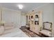 Sitting room showcasing white sofa and decorative cabinet at 1325 Peachtree Ne St # 401, Atlanta, GA 30309