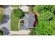 Bird's eye view of home highlighting the roof, large driveway, and proximity to mature trees at 1875 Briergate Dr, Duluth, GA 30097