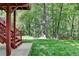Lush backyard with mature trees and a well-maintained lawn at 1875 Briergate Dr, Duluth, GA 30097