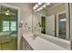 Bright bathroom with a spacious white vanity and large mirror at 1875 Briergate Dr, Duluth, GA 30097