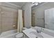 Bathroom with tile surround and a combination tub and shower at 1875 Briergate Dr, Duluth, GA 30097