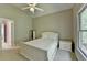 Inviting bedroom with a ceiling fan, natural light, and serene atmosphere at 1875 Briergate Dr, Duluth, GA 30097