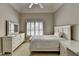 Bedroom with neutral paint, white furniture, and a ceiling fan at 1875 Briergate Dr, Duluth, GA 30097