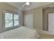 Calm bedroom with a large window, closet, and ceiling fan at 1875 Briergate Dr, Duluth, GA 30097