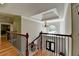 A grand foyer entrance with decorative wrought iron staircase and chandelier at 1875 Briergate Dr, Duluth, GA 30097