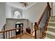 Grand foyer boasts soaring ceilings, arched window, and detailed millwork at 1875 Briergate Dr, Duluth, GA 30097