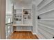 Hallway features built-in bookshelves with display space and offers views of the exterior at 1875 Briergate Dr, Duluth, GA 30097