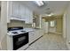 Cozy kitchen featuring white cabinetry, modern appliances, and ample counter space at 1875 Briergate Dr, Duluth, GA 30097