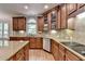 Beautiful kitchen boasts wood cabinets, stainless steel appliances, granite countertops, and ample counter space at 1875 Briergate Dr, Duluth, GA 30097
