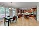 Open kitchen with dark wood cabinets, stainless appliances, and a large island at 1875 Briergate Dr, Duluth, GA 30097