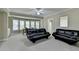 Bright and airy living room with a ceiling fan, carpeting and large windows at 1875 Briergate Dr, Duluth, GA 30097