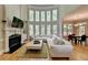 Bright living room featuring large windows, hardwood floors, and a fireplace at 1875 Briergate Dr, Duluth, GA 30097