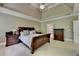 Comfortable main bedroom features a tray ceiling, and ensuite at 1875 Briergate Dr, Duluth, GA 30097