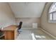 Office room features a vaulted ceiling, neutral paint, and carpet at 1875 Briergate Dr, Duluth, GA 30097