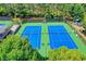 Aerial view of community tennis courts, featuring multiple courts and well-maintained landscaping at 1875 Briergate Dr, Duluth, GA 30097