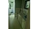 Bathroom featuring a sink with cabinets, a mirror, a toilet, and a shower with tile surround at 2291 Piney Grove Rd, Loganville, GA 30052