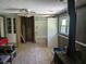 Spacious living room showing unfinished construction and featuring a ceiling fan and paneled walls at 2291 Piney Grove Rd, Loganville, GA 30052