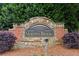 Morningbrooke community entrance sign surrounded by brick, stone, and mature landscaping at 4114 Suwanee Trail Dr, Buford, GA 30518