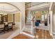 Inviting foyer with hardwood floors, staircase, and views into the living and dining areas at 4114 Suwanee Trail Dr, Buford, GA 30518