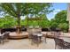 Outdoor grilling area with built-in grills and ample seating on a wooden deck at 4114 Suwanee Trail Dr, Buford, GA 30518