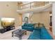 Spacious living room with two-story ceiling, large windows, and comfortable seating at 4114 Suwanee Trail Dr, Buford, GA 30518