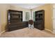 Bright office space featuring built-in shelves and a desk with natural light at 4114 Suwanee Trail Dr, Buford, GA 30518