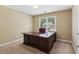 Home office with a large desk and natural light from the window at 4114 Suwanee Trail Dr, Buford, GA 30518