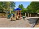 Community playground with slides, climbing wall, and swings for children to enjoy at 4114 Suwanee Trail Dr, Buford, GA 30518
