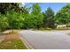 Scenic street view showcases lush trees and landscaping in the Morningbrooke neighborhood at 4114 Suwanee Trail Dr, Buford, GA 30518