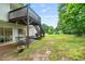 A backyard with patio seating under a deck and green grass at 6397 Autumn View Nw Trce, Acworth, GA 30101