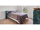 Bedroom with bed and side tables and window at 6397 Autumn View Nw Trce, Acworth, GA 30101