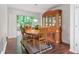 Charming dining room with a round table, china cabinet, and sliding glass door to a patio at 6397 Autumn View Nw Trce, Acworth, GA 30101