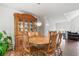 This dining room features a wooden table, hardwood floors, and a large cabinet at 6397 Autumn View Nw Trce, Acworth, GA 30101