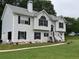 Charming two-story home with light siding, black shutters, attached garage, and a manicured front yard at 6397 Autumn View Nw Trce, Acworth, GA 30101