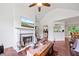Bright living room featuring hardwood floors, a fireplace, and open access to the kitchen at 6397 Autumn View Nw Trce, Acworth, GA 30101