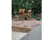 Community playground with a wooden play structure, slides, swings, and climbing features for enjoyment at 6397 Autumn View Nw Trce, Acworth, GA 30101