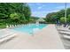 A community pool with lounge chairs and a pool house at 6397 Autumn View Nw Trce, Acworth, GA 30101