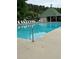 Community swimming pool with plenty of lounge chairs and a covered area for relaxation and shade at 6397 Autumn View Nw Trce, Acworth, GA 30101
