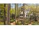 Beautiful backyard featuring lush greenery, mature trees and serene pond at 769 Hampton Sw Pl, Marietta, GA 30064