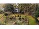 Inviting backyard garden features raised planting beds, mature plants and a glimpse of the main house at 769 Hampton Sw Pl, Marietta, GA 30064